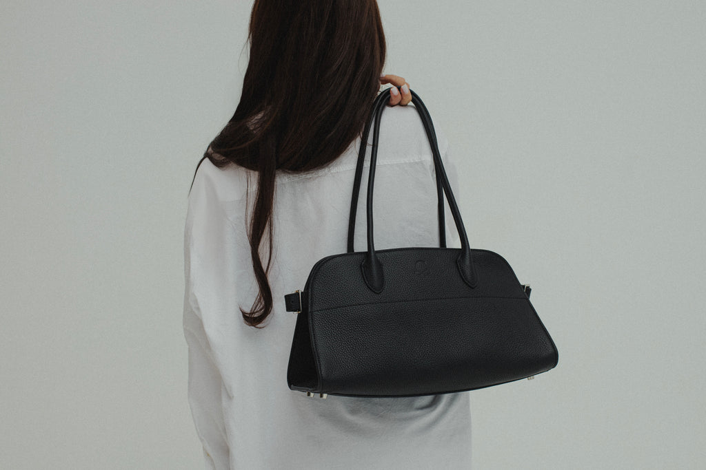 The Serena Bag — full-grain leather tote, worn on the shoulder