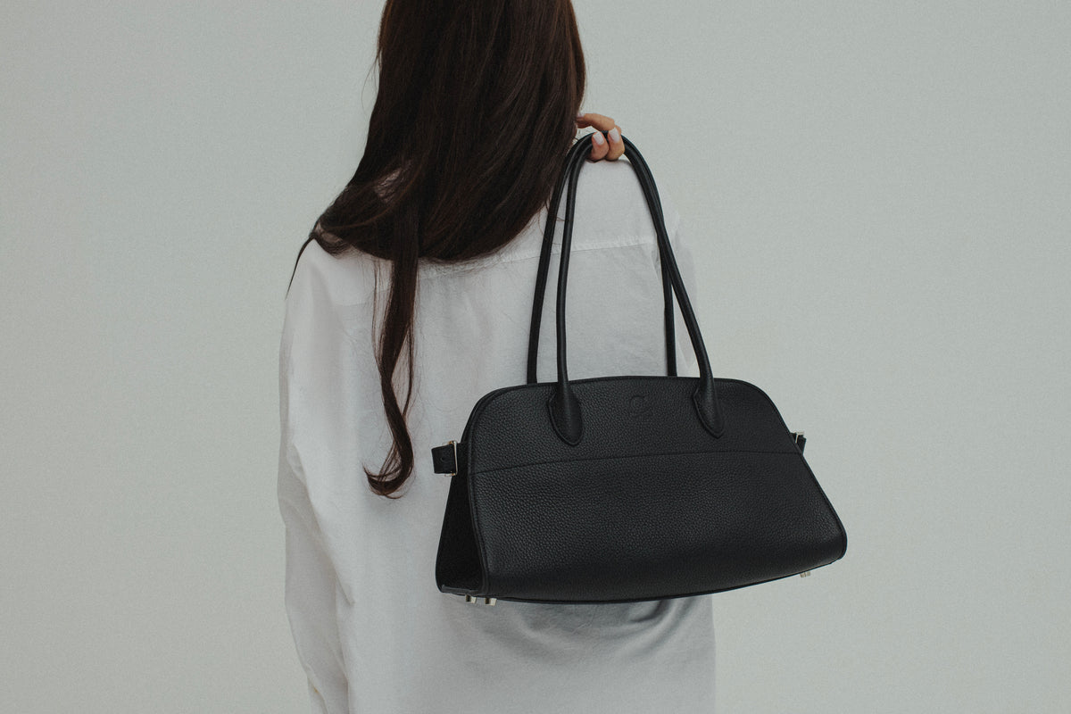 The Serena Bag — full-grain leather tote, worn on the shoulder