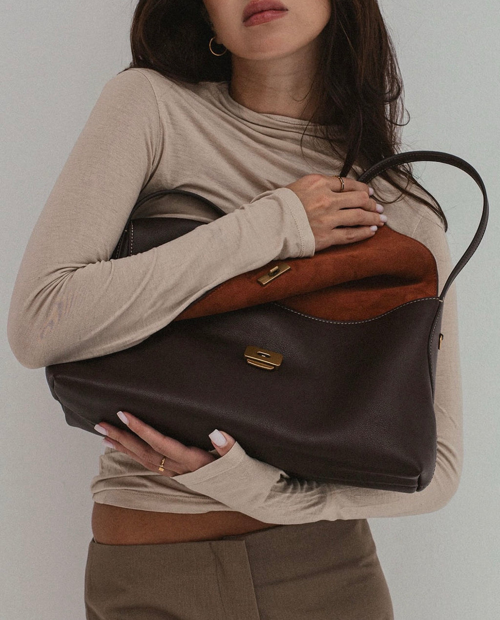 The Camille Bag — top-grain leather handbag with gold-tone hardware, front view